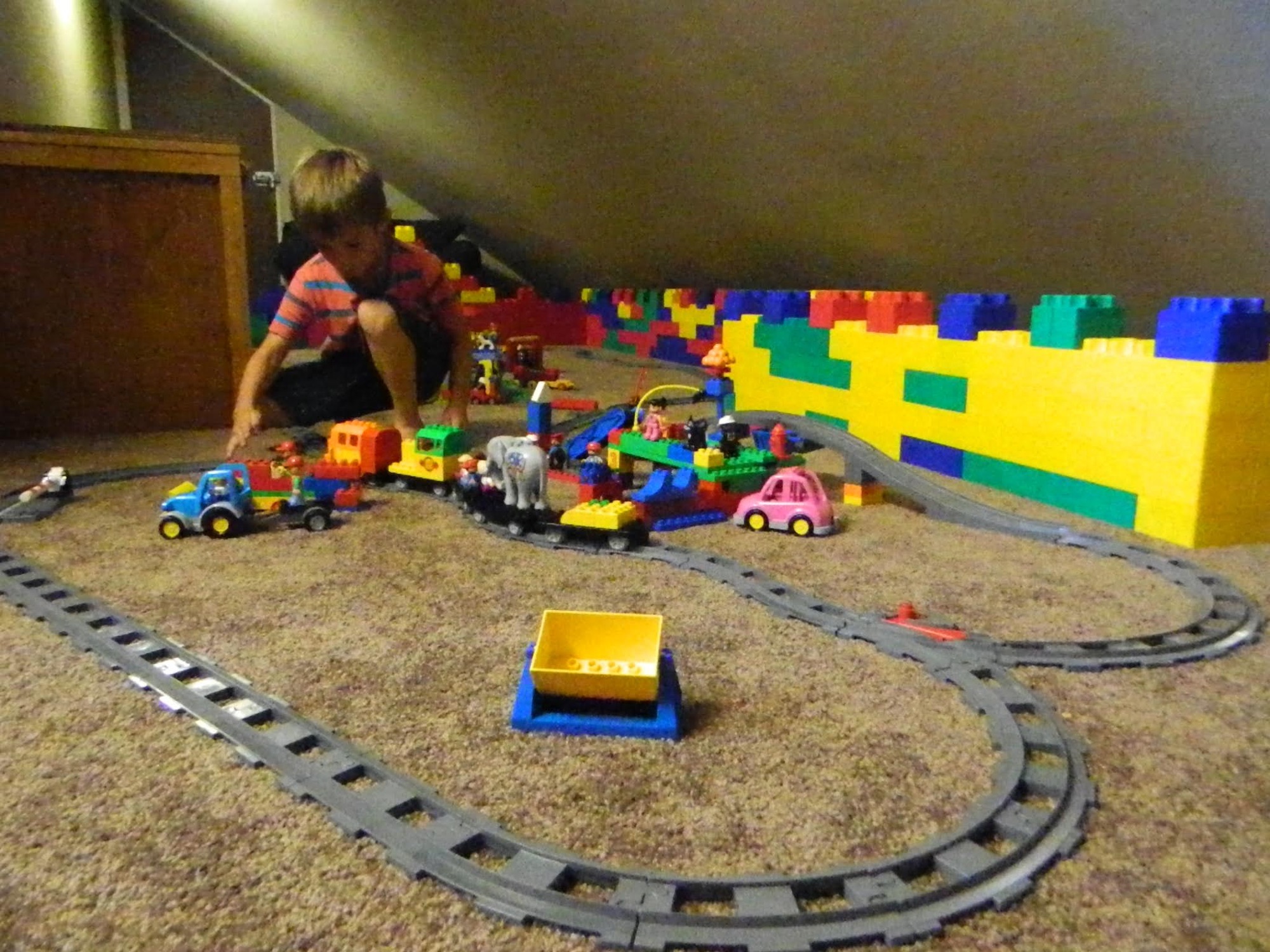A child playing with the train set