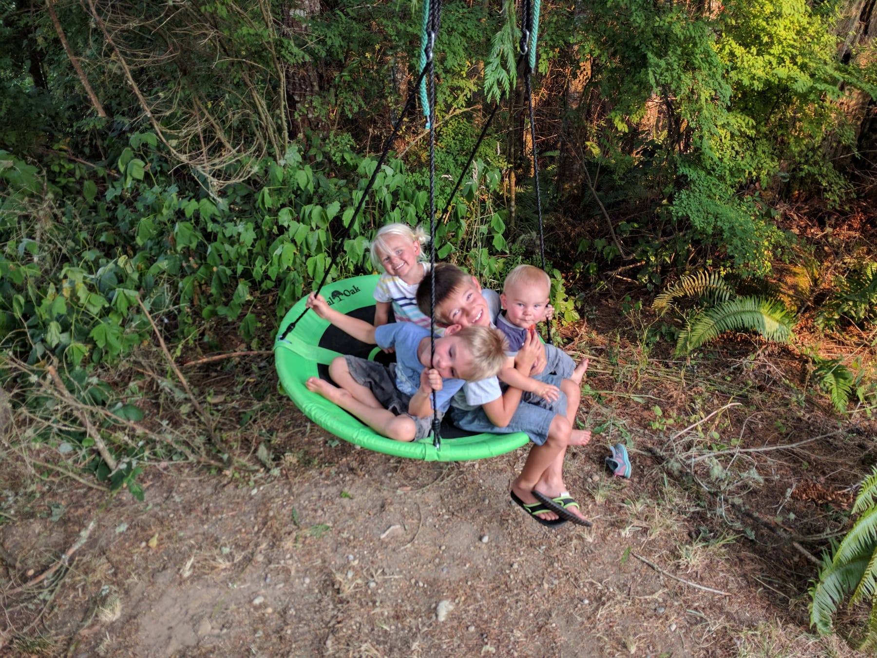 Kids piled on the saucer swing