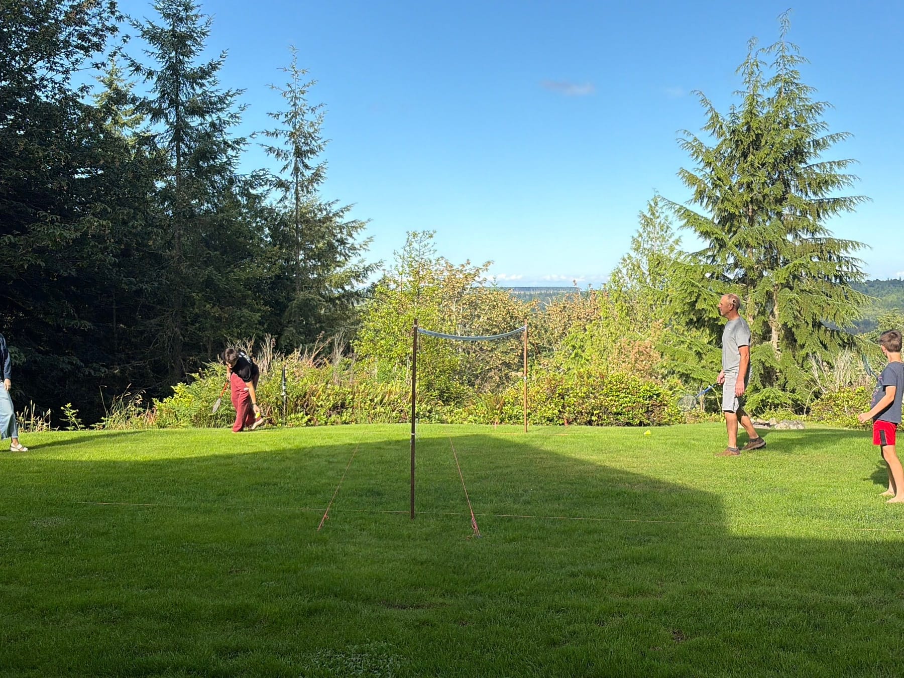 Volleyball on the lawn with the valley beyond