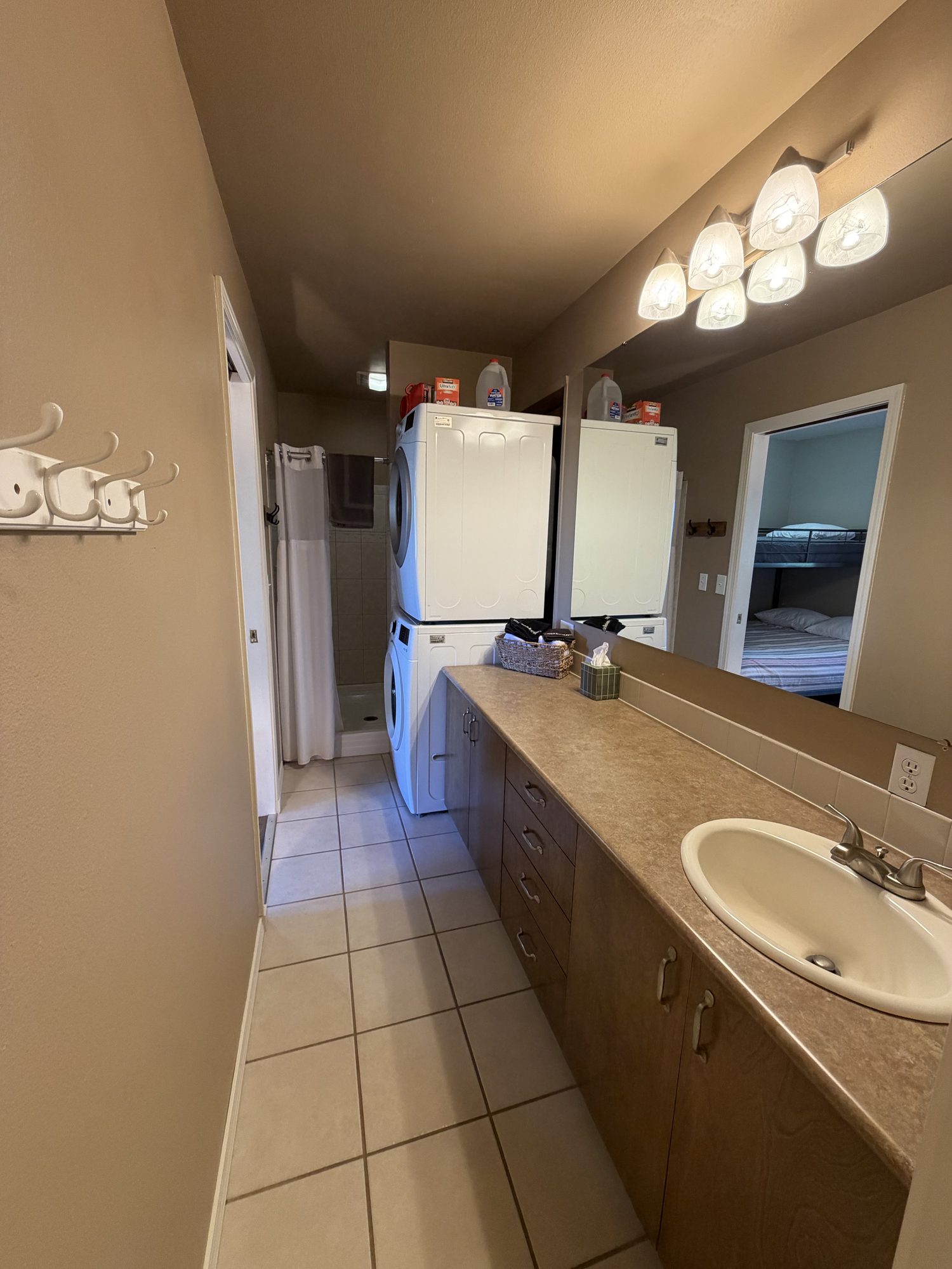 Lower-level bath with washer and dryer