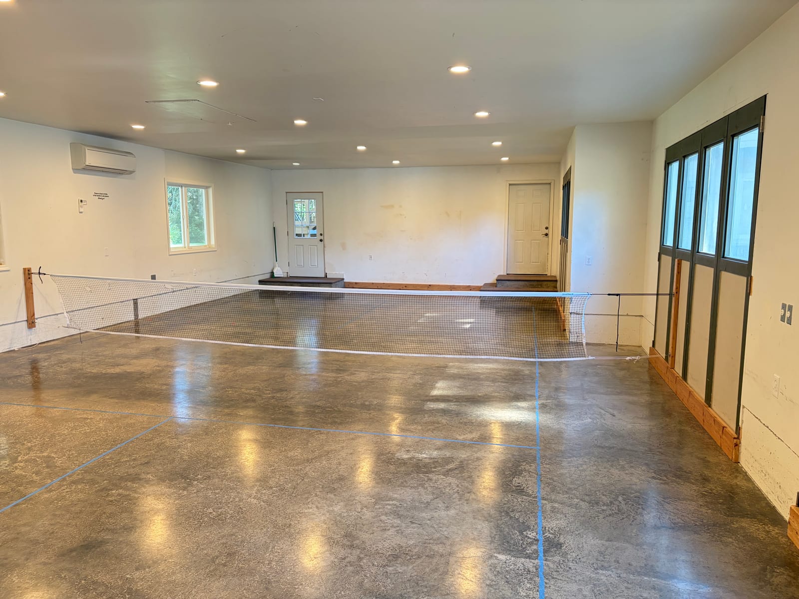 Indoor playroom with pickleball net